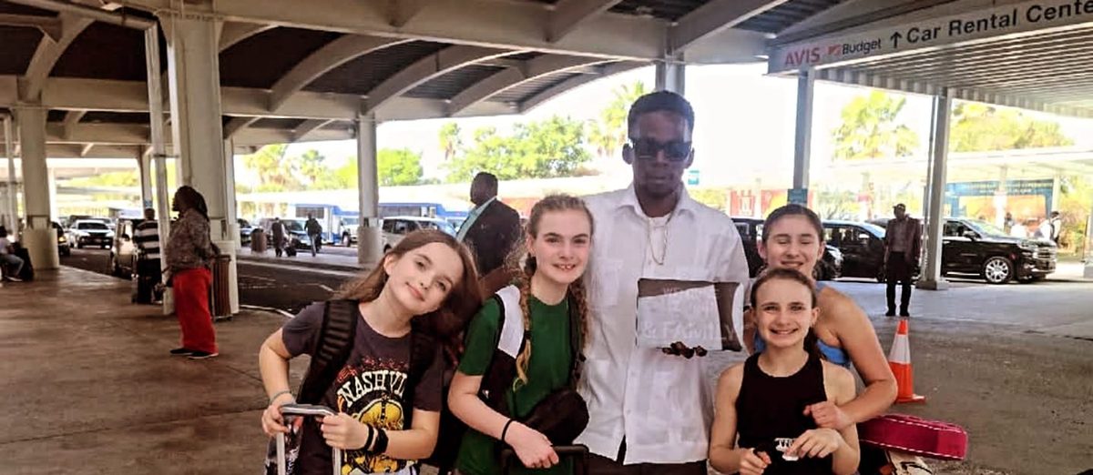 Mike meeting four girls and their luggage at LPIA International Arrivals