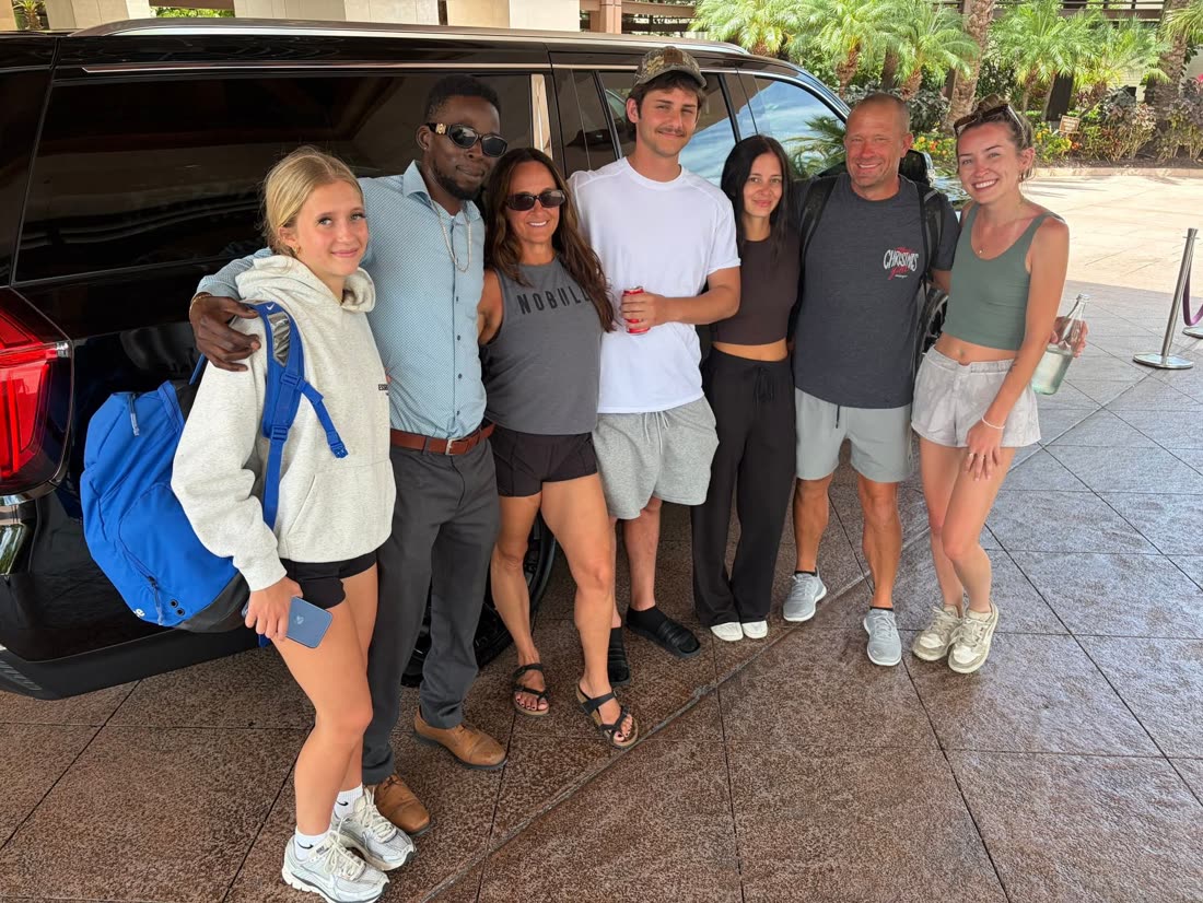 Mike with a group of seven beside the Yukon