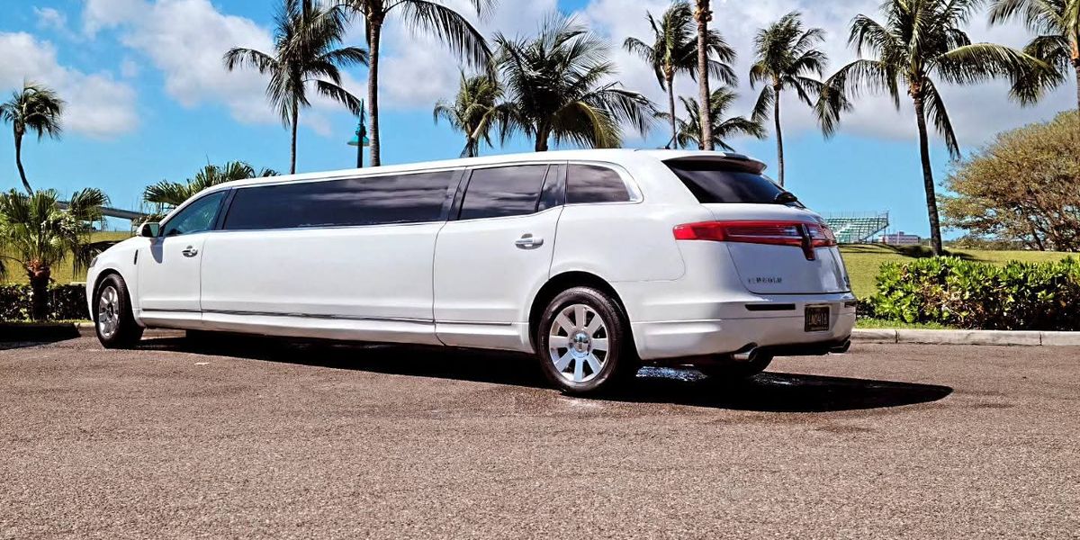 The Lincoln MKT stretch limo under the palms